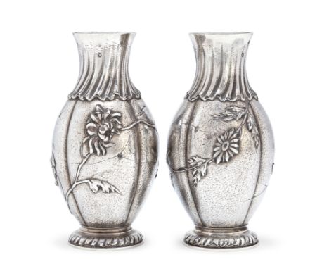 A pair of 'Japonesque' French silver vases.Alphonse Debain, Late 19th/early 20th century.The baluster bodies decorated with a