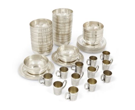 A group of silver plate. The group comprising: a set of twelve small French cups by Armand Frenais, the scrolling handles wit