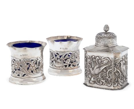 A Victorian silver tea caddy. William Comyns & Sons, London, 1891. The rectangular body with canted corners and crimped borde