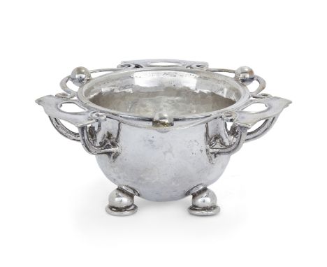 An Arts & Crafts silver bowl. Omar Ramsden and Alwyn Carr, London, 1910. The planished, rounded bowl raised on three feet, de