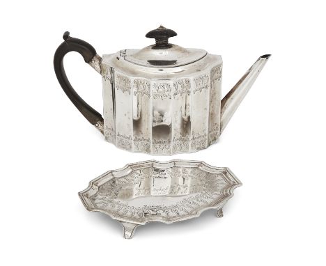 A George III silver teapot and stand. Henry Chawner, London, 1789. Of shaped, oval form, the teapot and stand with bright cut
