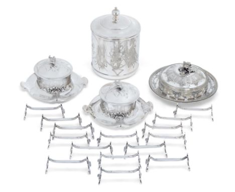 A group of silver plate. The group comprising: fifteen silver plated knife rests by Christofle, each decorated with scrolling