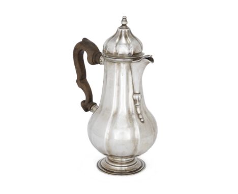 An 18th century Italian silver coffee pot. Lucca. The fluted, baluster body raised on a stepped circular foot, designed with 