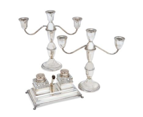 An Italian inkstand with glass inkwells. Greggio Rino, Padua, 20th century.The rectangular inkstand raised on four paw feet a