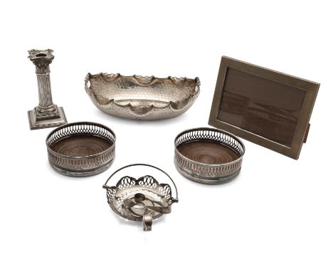 A group of silver and silver plate. Various dates and makers. The group including: a German silver basket, the planished body