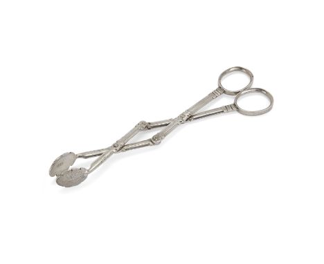 A pair of silver four-hinge-mechanism sugar nips.Possibly Augsburg, c.1765.Designed with foliate grips to trellis arms and ov