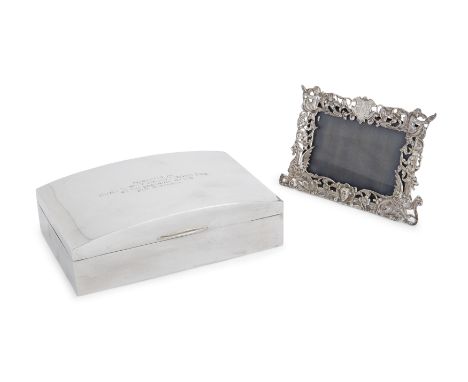 A Victorian silver photo frame. William Comyns, London, 1889. The pierced, rectangular frame richly decorated with winged chi