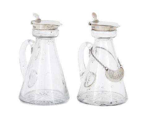 A pair of George V silver mounted whisky noggins. Goldsmiths & Silversmiths Co., London, 1916. The tapering glass bodies to s