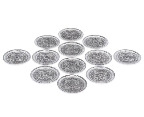 A set of twelve Iranian (Persian) silver coasters.Mark of Mahmud Rabi'i, retailed by Pirayesh.Isfahan, c.1970. Of circular fo