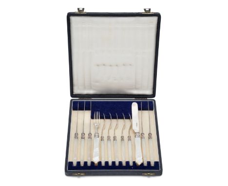 A boxed set of dessert knives and forks. Aaron Hadfield (probably), Sheffield, 1848. The carved mother of pearl handles to pl