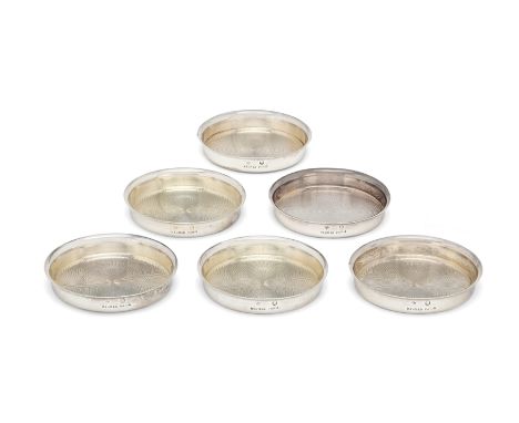 A set of six French silver ashtrays. Hermes,Paris, 20th century.The circular ashtrays designed with engine turned decoration 