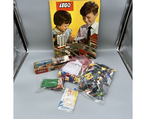 A collection of vintage Lego items and a vintage Lego road system
