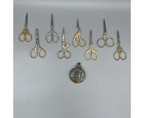 A collection of fancy scissors and jade item