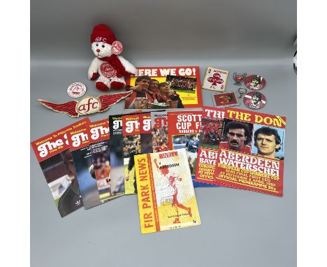 A mixed lot of vintage Aberdeen football memorabilia, badges, a teddy, programmes