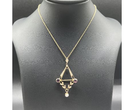 A Victorian 9ct yellow gold amethyst and pearl necklace,
chain is 18 inches long,
pendant is 2 inches x 1 inch,
converts into