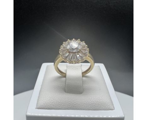 A 14ct yellow gold white cz stone set ring,
size K,
3.4 grams in weight