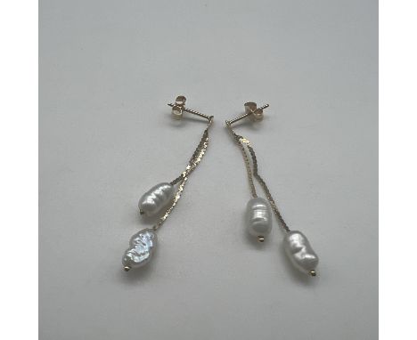 A pair of seed pearl drop earrings,
butterfly back,
14ct yellow gold,
1.2 grams in weight,
drop is 35mm