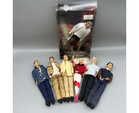 A collection of Boyzone dolls and a Michael Jackson singing doll, a 1994 Barbie doll 