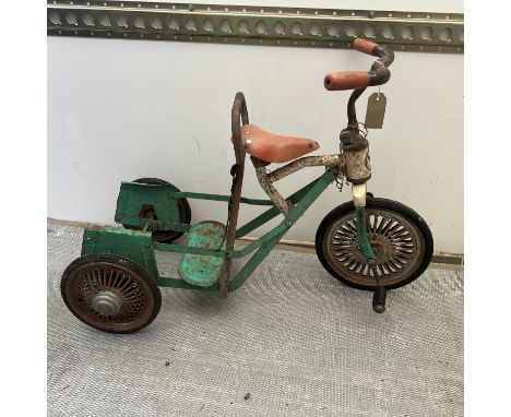 A childs eagle globe vintage tin plate pedal bike