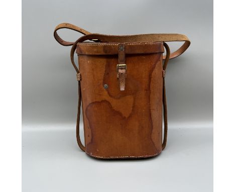 A leather vintage binocular case with binoculars, not original binoculars