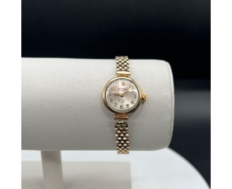 A 9ct yellow gold Rotary ladies watch, manual wind up, case bracalet and clasp are all 9ct yellow gold, total weight 15 grams