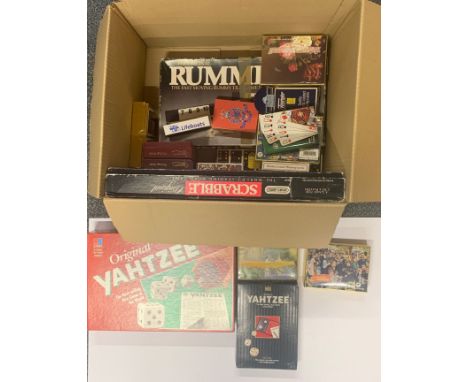 A quantity of vintage playing cards and board games.