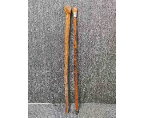 A Japanese carved bamboo walking stick, together with a natural form walking stick.