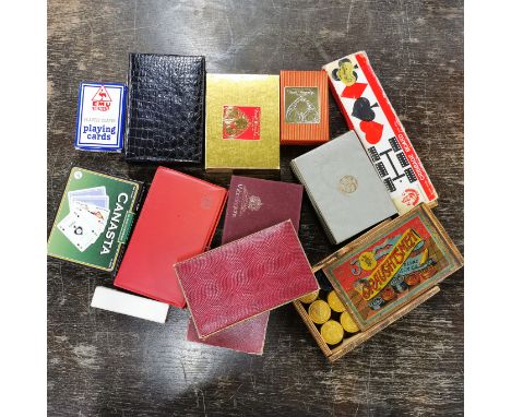 A quantity of vintage playing cards and games.