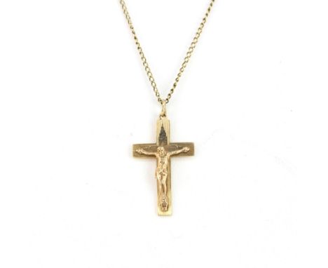 A hallmarked 9ct yellow gold crucifix pendant, L. 3cm, on a 9ct gold chain, L. 41cm. Total weight approx. 4.5gr.&nbsp;