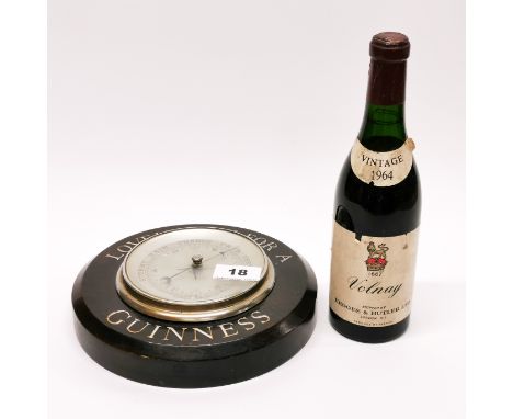 A vintage Guinness advertising barometer, Dia. 21cm, together with a 1964 half bottle of Volnay red wine.