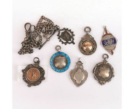 A group of silver fobs and chain.