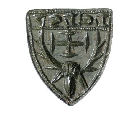 14th century, a bronze seal matrix, measuring 20mm x 17mm, by 19mm high, shield-shaped with central loop behind, central moti