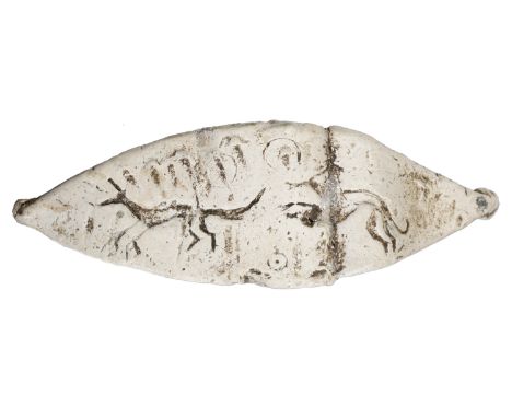 Romano-British, 1st-2nd century, a lead tag, measuring 95mm x 30mm x 3mm, pointed oval with knobbed ends, decorated with a do