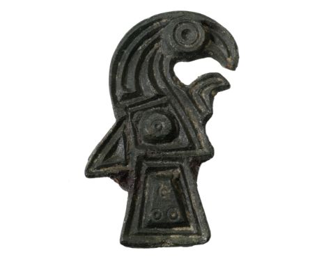 Frankish, 6th century, a bronze Eagle brooch, measuring 32mm x 21mm, Chip carved with central boss containing ring and dot mo