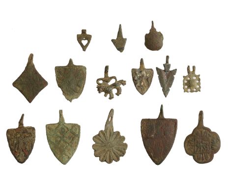 13th-14th Century, Bronze heraldic pendants (14), including shield-shaped with three hands in red enamel (Malmains); double-h