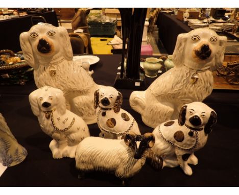 Two pairs of Staffordshire flatback dogs and a ceramic Ram