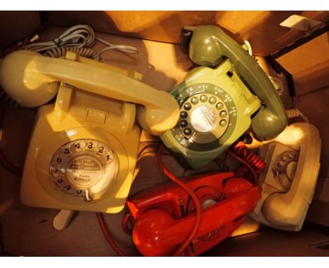 Four vintage dial telephones in good condition 
