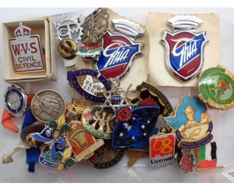 Box of enamel badges 
