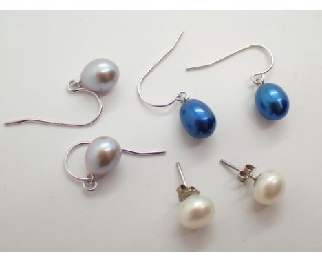 Three pairs of genuine pearl and silver earrings