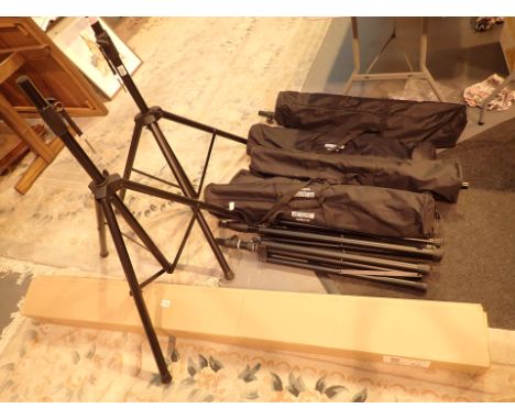 Fourteen speaker stands and a large screen