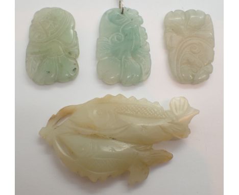 Four Chinese light green jade carvings to include The Auspicious Golden Fish symbol for spiritual liberation 6.5 cm and three
