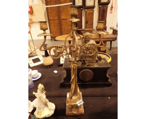 Brass triple candlestick on a marble base H: 60 cm