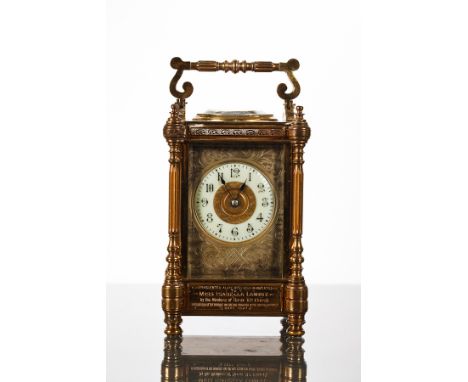 LATE 19TH-CENTURY FRENCH BRASS CARRIAGE CLOCK the enamel dial with Arabic numerals inset in an engraved silvered panel, with 