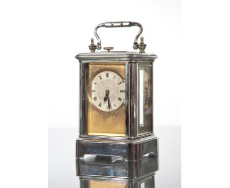 MINIATURE CARRIAGE TIMEPIECE
the engraved dial with Roman numerals, in white metal and on bracket feet, 9.5cm high