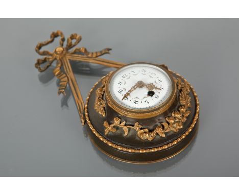 19TH-CENTURY FRENCH ORMOLU SEDAN CLOCK 
of circular form, suspended from rods with ribbon crest, the enamel circular dial wit