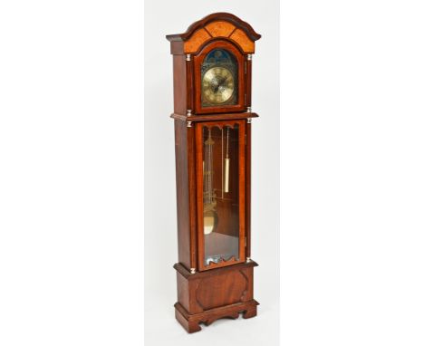 MODERN MAHOGANY GRANDMOTHER CLOCK
maker Bentima, with arched brass dial above a glazed door, on bracket feet, 181cm high
