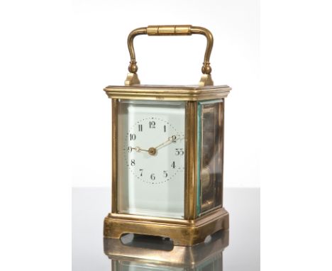 FRENCH BRASS CARRIAGE CLOCK
the enamel dial with Arabic numerals and brass moon hands, compensated platform escapement, chimi