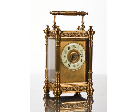 LATE 19TH-CENTURY FRENCH BRASS CARRIAGE TIMEPIECE
the enamel chapter ring with Arabic numerals, the four glass case with pier