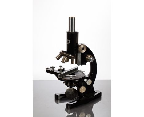 CARL ZEISS JENA MICROSCOPE
in black enamel, serial number 231619, approximately 36cm high, in a mahogany case with keys CONDI