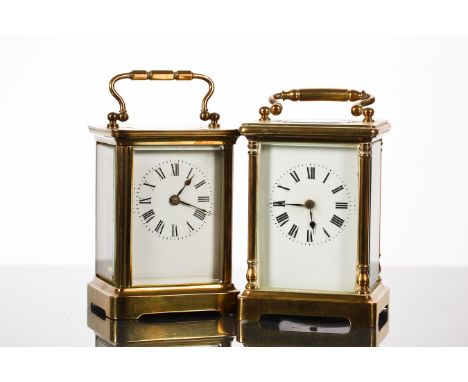 TWO 20TH-CENTURY FRENCH BRASS TIMEPIECES
the first with a Roman numeral dial and a swing handle, 15.5cm high, with its key an